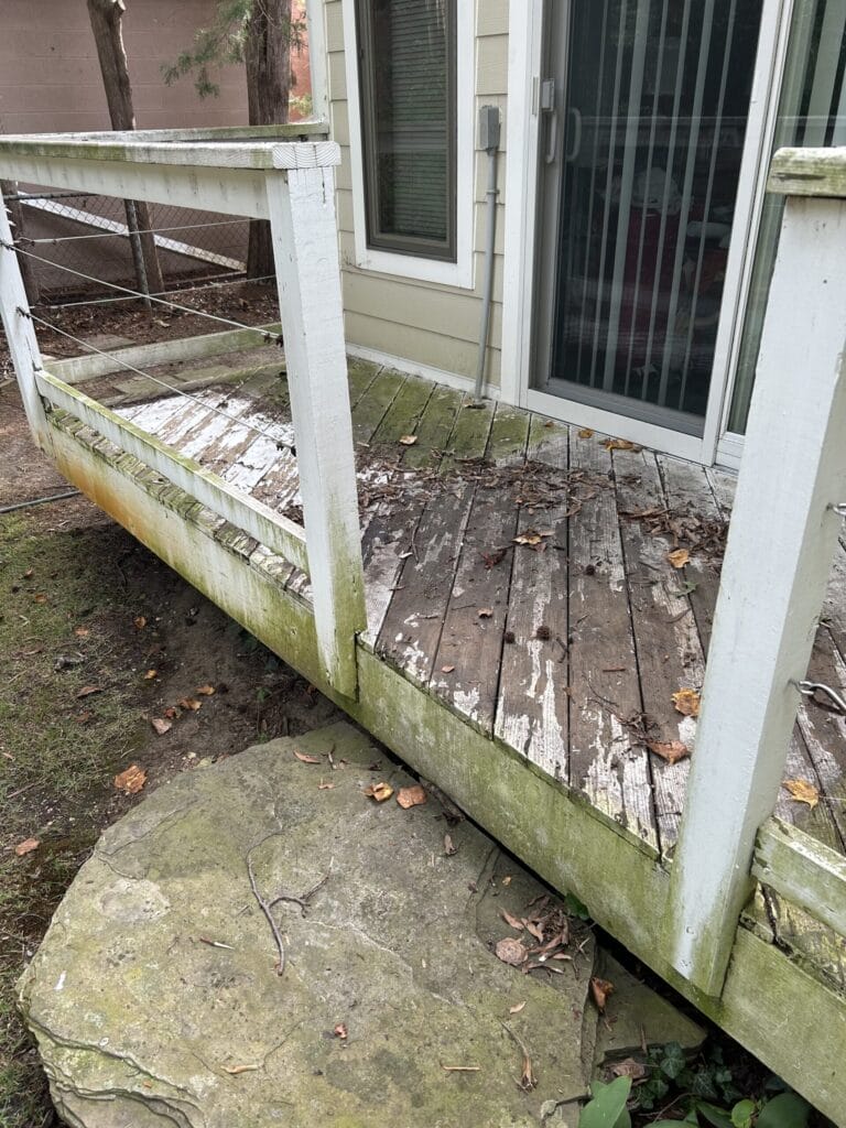 Keenwick team washing residential house exterior