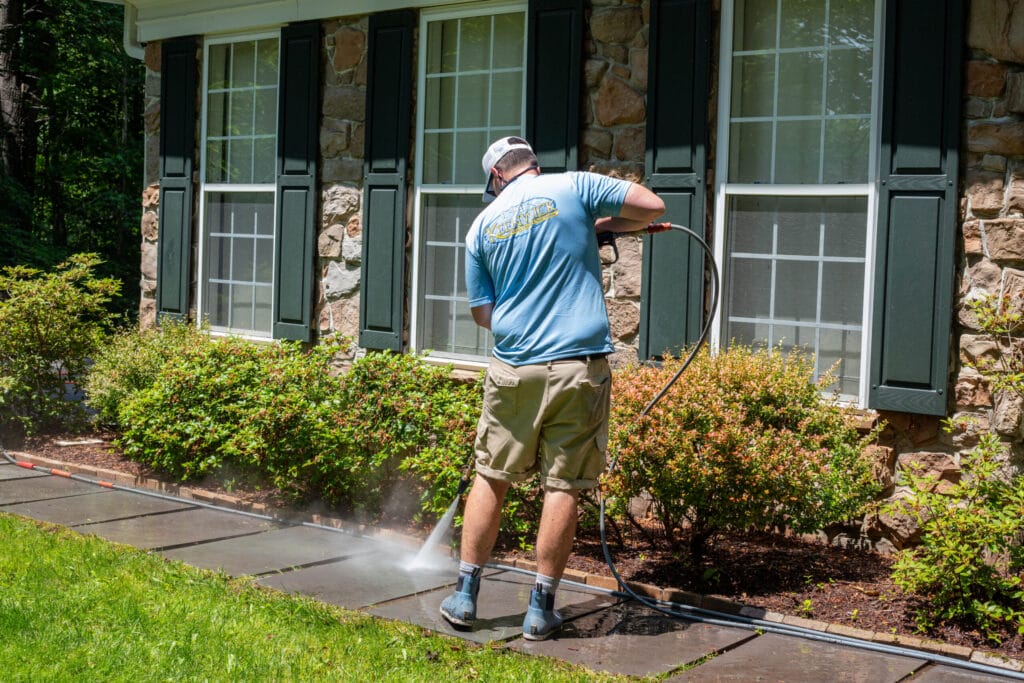 Keenwick team cleaning residential concrete driveway and walkway