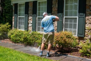 Keenwick team cleaning residential concrete driveway and walkway