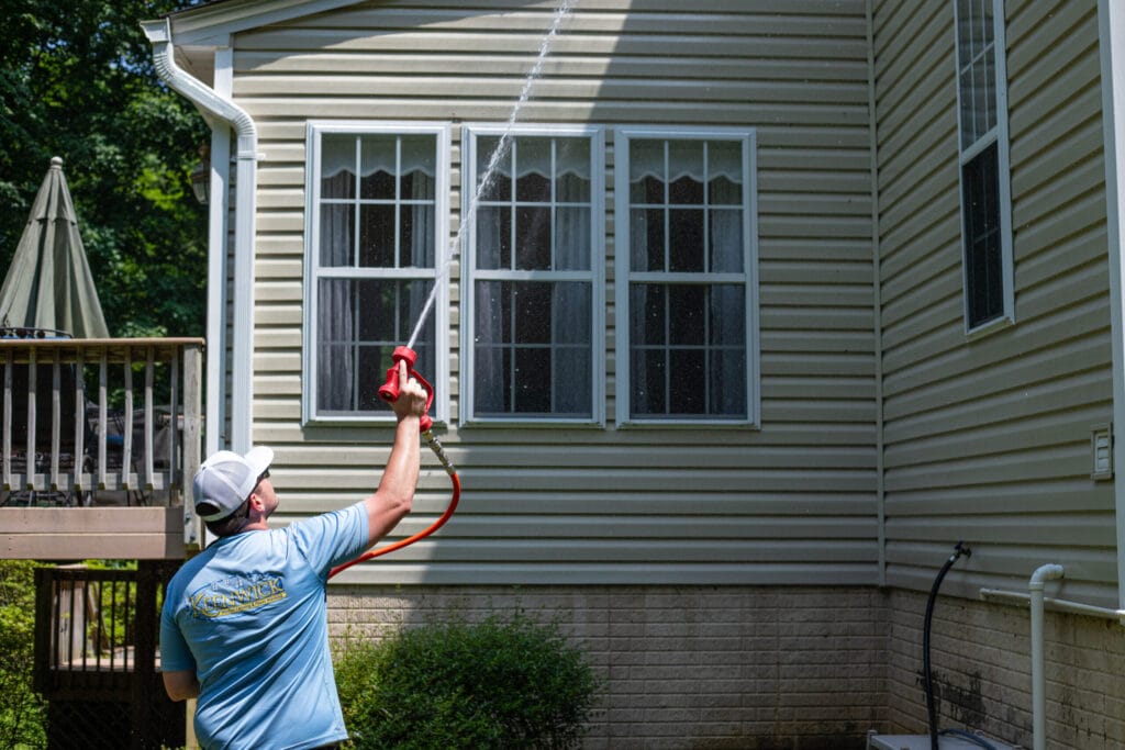 Soft washing service removing dirt, mold, and mildew from a residential exterior, restoring home’s cleanliness and freshness