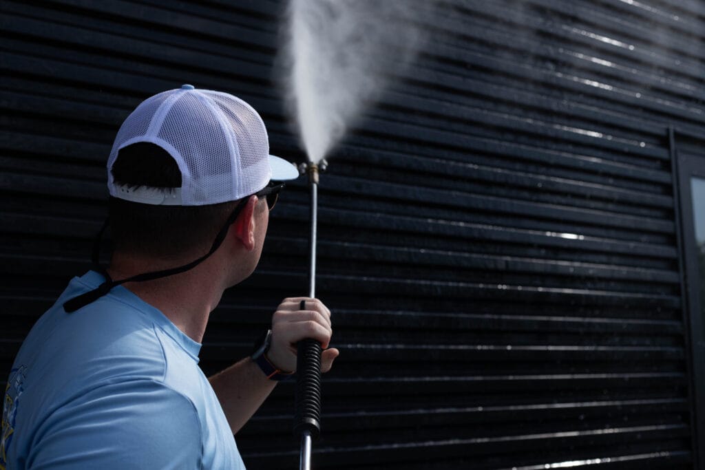 Commercial building exterior being power washed by Keenwick team