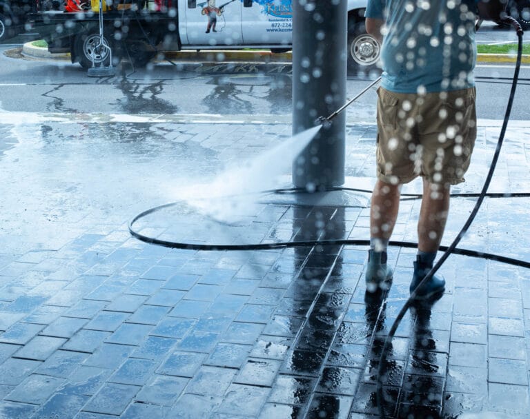 Keenwick team performing commercial power washing on building exterior