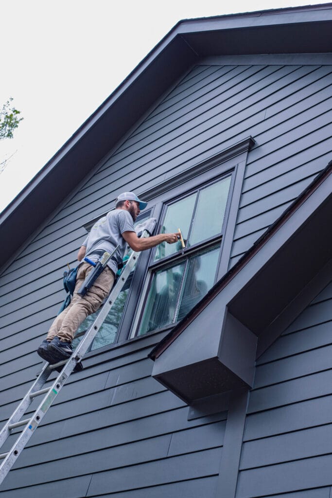 Exterior home windows being cleaned by Keenwick professionals.