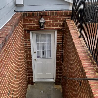 Wall-mounted lantern above entryway door at Maryland home cleaned by Keenwick
